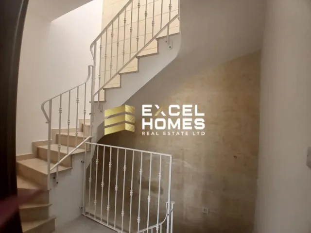 a stairway with a black and white photo of a man on it
